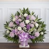 Standing floral spray with pink and white flowers and a lavender ribbon