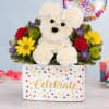 Birthday flower arrangement with white carnation dog, colorful blooms, and Happy Birthday balloon in a polka dot container
