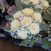 Bouquet of cream roses with baby's breath and eucalyptus