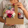 Gift box with pink flowers and a chocolate dessert cup