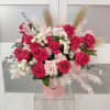 Pink and white rose bouquet in a pink hat box