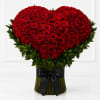Heart-shaped bouquet of red roses with a black ribbon wrap