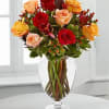 Mixed roses in a clear glass vase