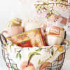 Delicate cherry blossom branches arching over a charming black wire basket set