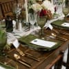 Floral table centerpiece with white and red roses on a set dining table