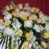 Peonies(Seasonal), Roses, Snapdragons, Stock,  ferns, Fancy Greens.
Peonies will be substituted out