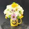 A bright dome of white hydrangeas crowned with yellow, lavender and green