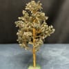 Gemstone tree sculpture with gold wire branches on a green stone base