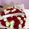 Bouquet of red and white roses with a "Be Mine?" ribbon