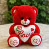 A soft and cuddly medium plush teddy bear holding a heart, perfect
