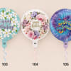Three birthday balloons with floral prints and curled ribbons