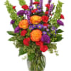 Colorful mixed bouquet in a clear glass vase