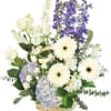 Basket arrangement with white roses, gerbera daisies, and purple flowers