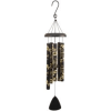 Hanging wind chime with patterned metal tubes and a black clapper