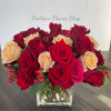 This arrangement uses only roses, densely packed to create a plush, painterly
