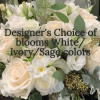 Soft cream and blush roses take center stage in this sympathy flower