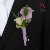 Designed with a single lavender rose and white spray rose and finished