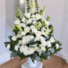 An elegant and serene floral arrangement designed with a harmonious blend of