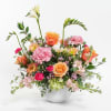 Mix of Spring-Garden-like flowers, peaches, pinks, light greens with
subtle scents of Stock