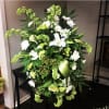 White and green standing spray. Assorted selection of neutral colored flowers arranged