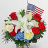     This heartfelt arrangement showcases classic red, white, and