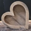 This multipurpose wooden heart can be used for decor.  Or, it