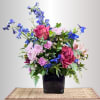This fun bouquet combines purple and blue flowers for a sweet gift