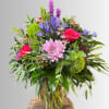 Large garden-style bouquet packed full of fun flowers in hues of pink