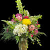 Full garden-style bouquet in a clear glass vase: hydrangeas, roses, snapdragons, mums