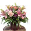 Stylish spring bouquet with pink lilies, roses, carnations, purple mums and mixed