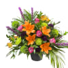 Bright mix of orange lilies, purple roses, and green cremons
