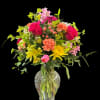 Stunning display of color using roses, carnations, alstromeria, and more