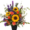 Colorful bouquet of sunflowers, carnations, delphinium and roses