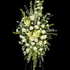 Gorgeous arrangement of white flowers includeing lilies, roses, carnations, and delphinium