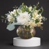 White chrysanthemum and alstroemeria arrangement in a round glass vase
