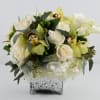 silver square vase 
with some fresh cut white roses combined with white
