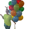 Person holding a bunch of colorful balloons with a small balloon animal on her head
