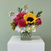 Solara is a bright and cheerful floral arrangement designed in a classic