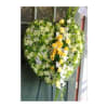Heart-shaped floral wreath with yellow and white flowers