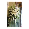 Tall white floral standing spray on an easel