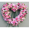 Heart-shaped pink floral wreath with ribbon tails
