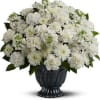 White chrysanthemum bouquet in a black urn vase