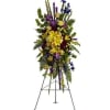 Tall standing floral spray with yellow, purple, and blue flowers