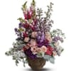 In the garden, fresh flowers bloom and nature's beauty reigns. Send this