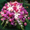 Pink and purple bouquet with white lilies and roses