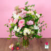 Pink and white mixed bouquet in a clear glass vase