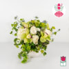 White and green floral arrangement in a decorative vase