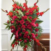 Tall red floral standing spray with roses and lilies