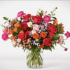 Bright Delight is vibrant, garden-style arrangement featuring a mix of seasonal blooms