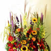 A warm arrangement filled with thoughtfulness: Gerbera, Liatrus, Cattail, Solidago, Lilies, Sunflowers